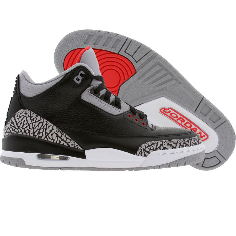 Black leather shoes with grey accents on the tongue and heel. Red and grey sole.